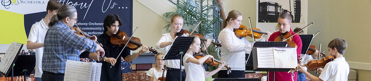 advanced students playing violins