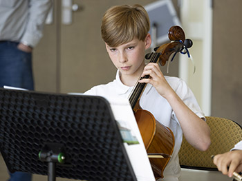 young man playing cello