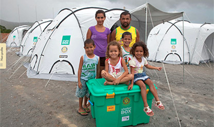 Family in front of shelter