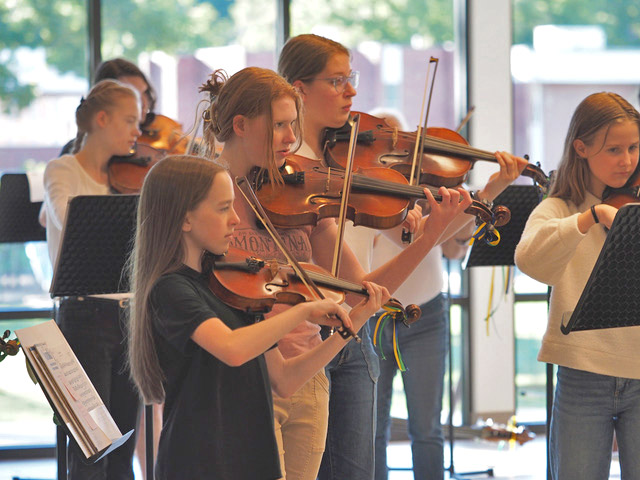 Young people playing violin